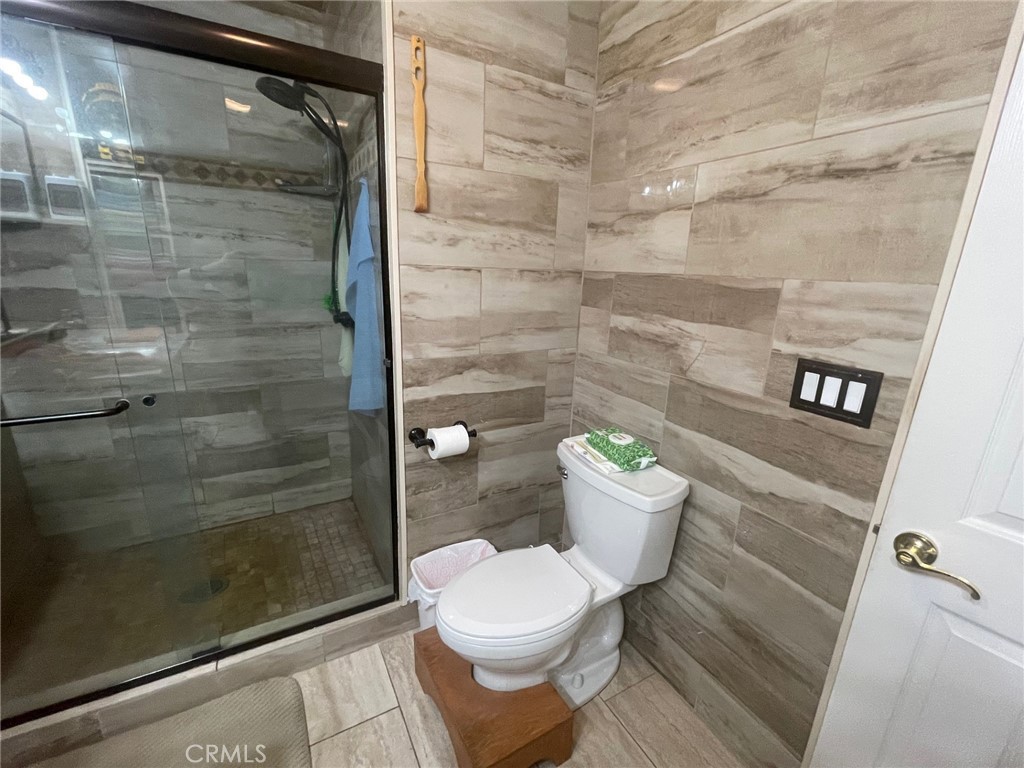 26326 Investors Hemet, CA 92544 - Photo 24 of 46 a bathroom with a toilet and a shower