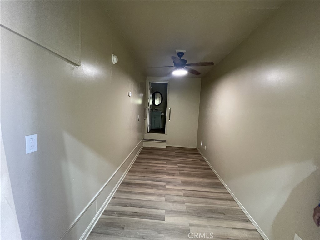 26326 Investors Hemet, CA 92544 - Photo 29 of 46 a view of a hallway with wooden floor and stairs