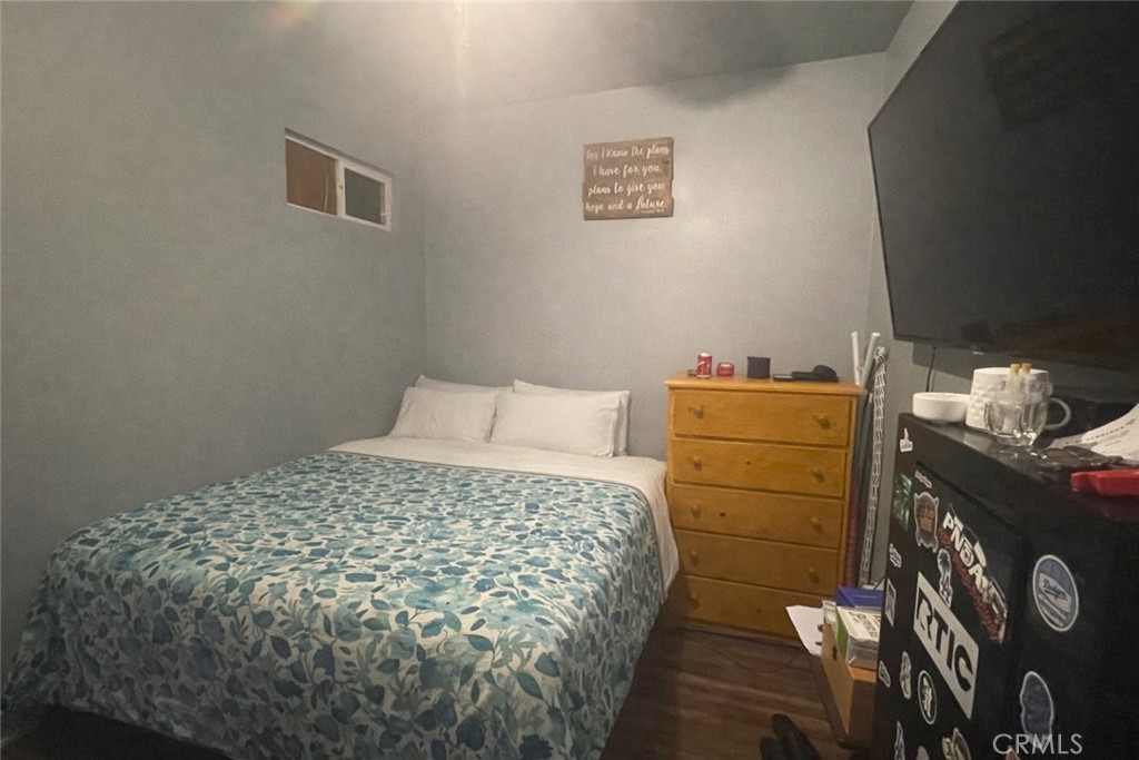 26326 Investors Hemet, CA 92544 - Photo 36 of 46 a bed sitting in a bedroom next to a window and a lamp