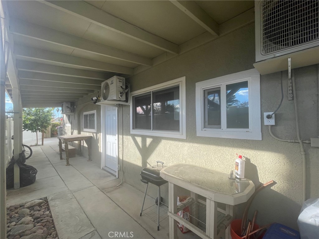 26326 Investors Hemet, CA 92544 - Photo 37 of 46 a dining room with furniture and a large window