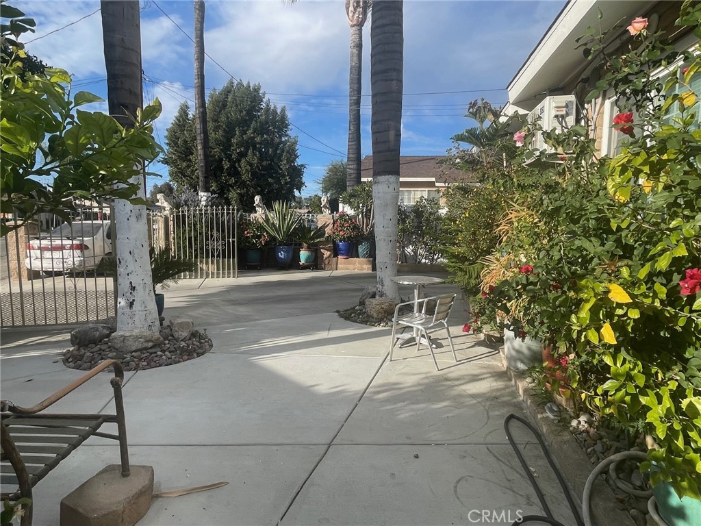 26326 Investors Hemet, CA 92544 - Photo 40 of 46 a view of a patio with table and chairs and potted plants