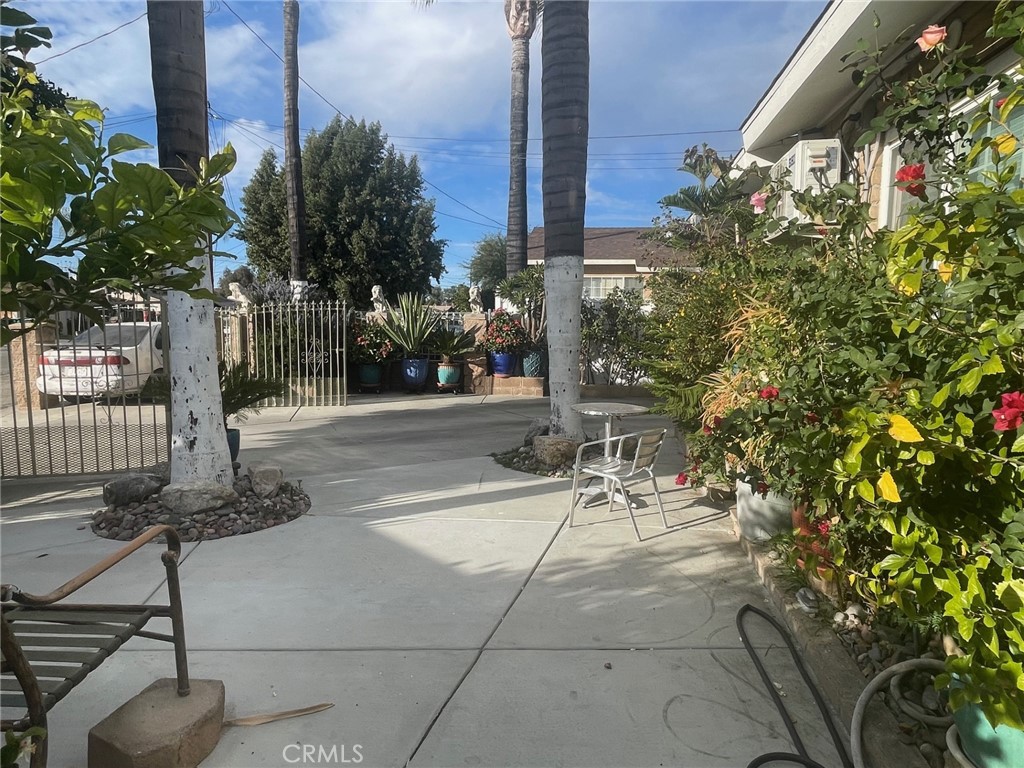 26326 Investors Hemet, CA 92544 - Photo 44 of 46 a view of a patio with table and chairs and potted plants