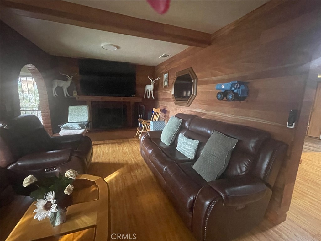 26326 Investors Hemet, CA 92544 - Photo 6 of 46 a living room with furniture and a flat screen tv