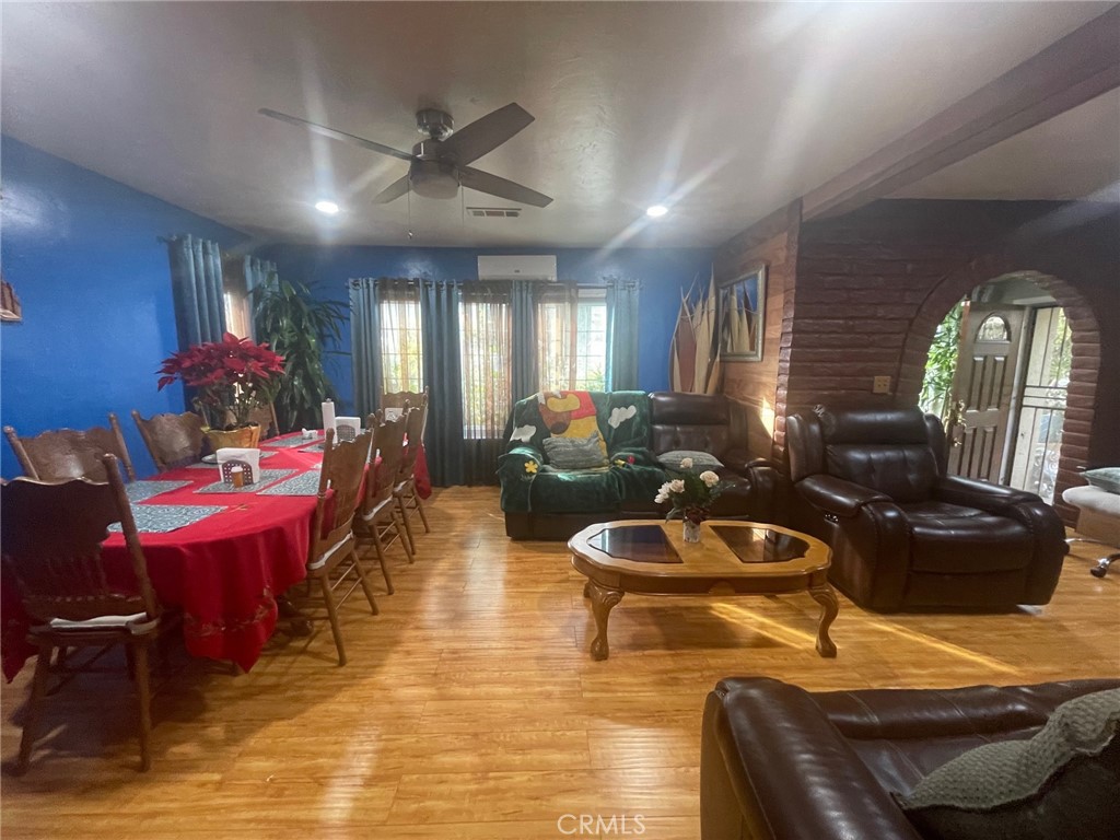 26326 Investors Hemet, CA 92544 - Photo 9 of 46 a living room with furniture a rug and a chandelier