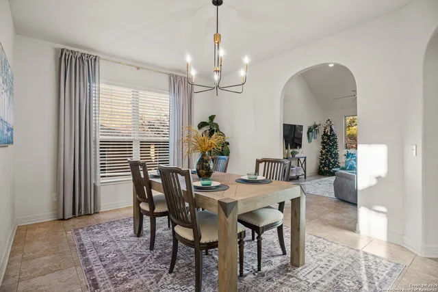 a view of a dining room with furniture and window