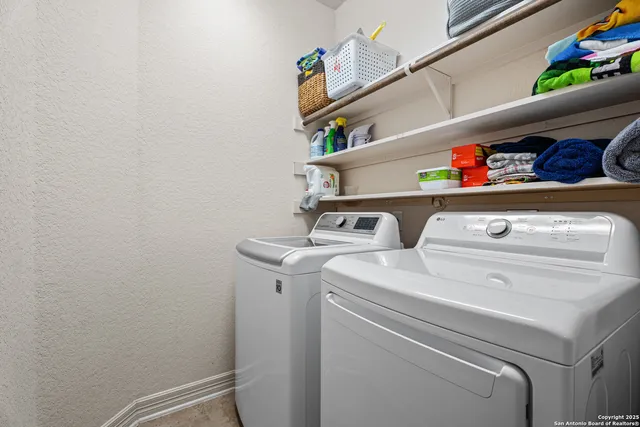 a utility room with dryer and washer