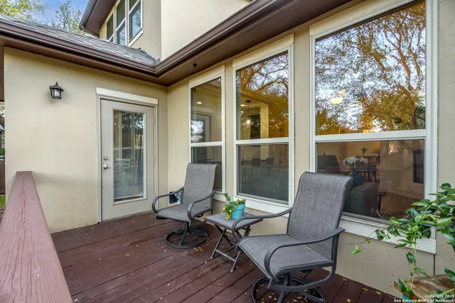 a balcony view with a seating space