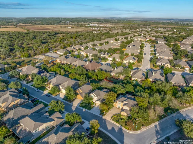 an aerial view of residential building and ocean