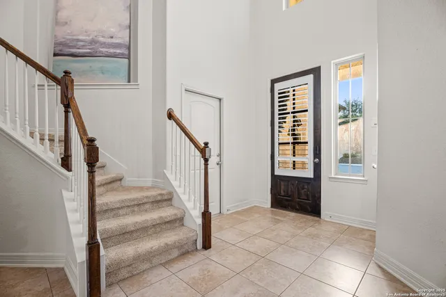 a view of an entryway with stairs