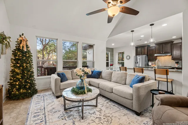 a living room with furniture and a large window