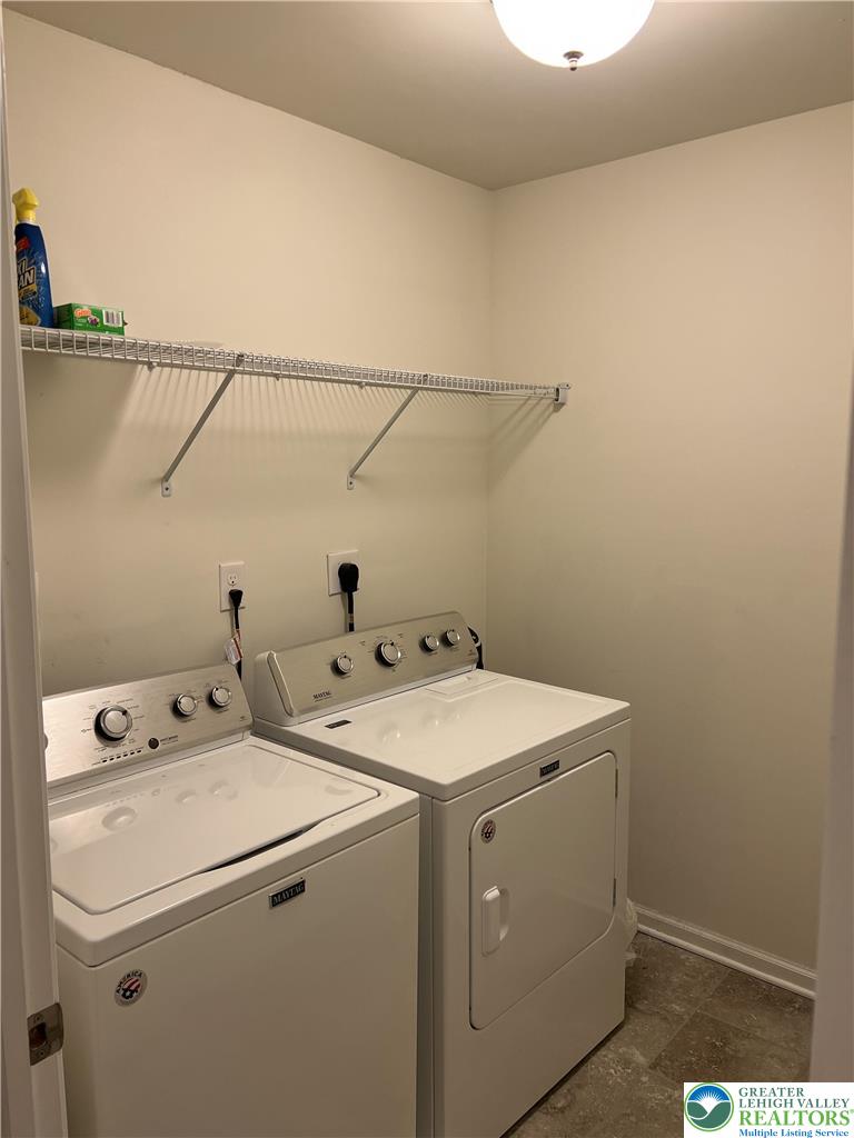 5380 Jutland Road Allentown, PA 18104 - Photo 23 of 27 Functional laundry space featuring a washer, dryer, and convenient overhead shelving.