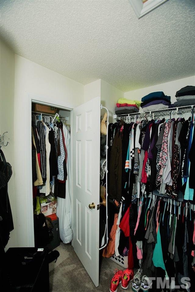 517 Jordan Ridge Lane Raleigh, NC 27603 - Photo 11 of 16 a view of walk in closet with clothes
