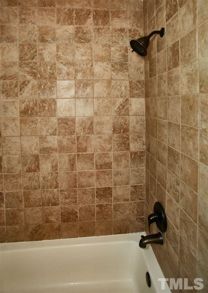 517 Jordan Ridge Lane Raleigh, NC 27603 - Photo 14 of 16 a bathroom with a bathtub