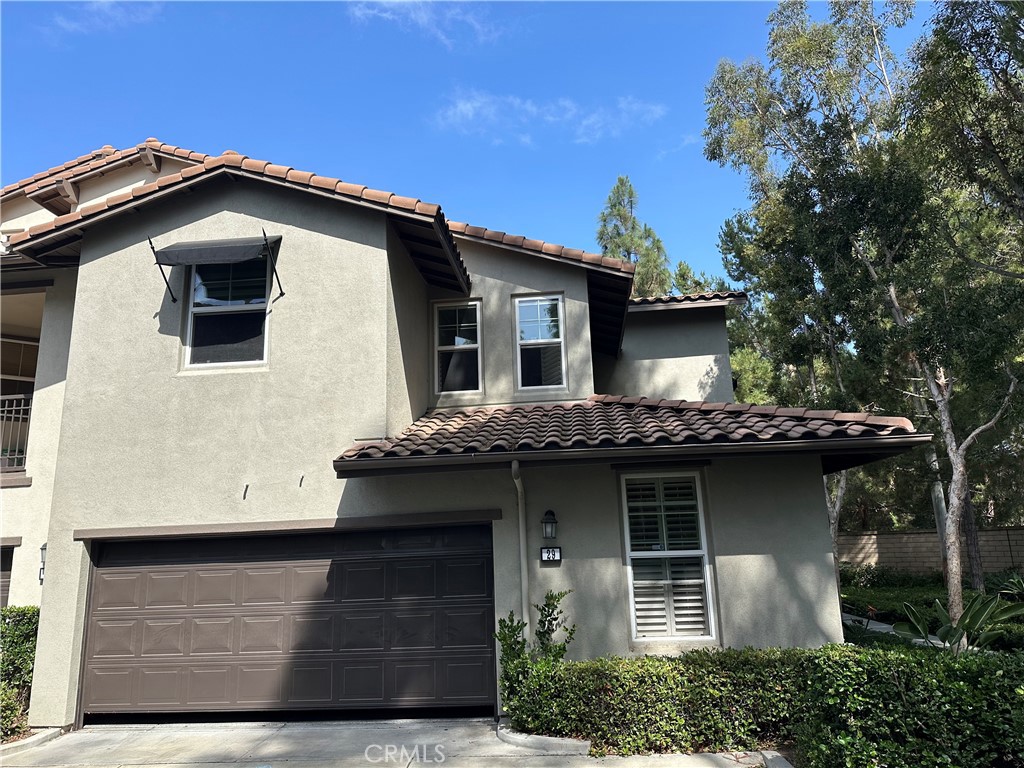 29 Stepping Stone Irvine, CA 92603 - Photo 1 of 10 a front view of a house with garage