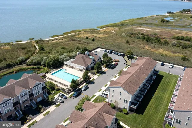 an aerial view of a house with a ocean view