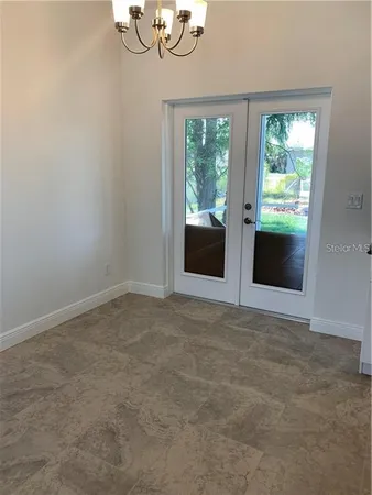 a view of an empty room with a window