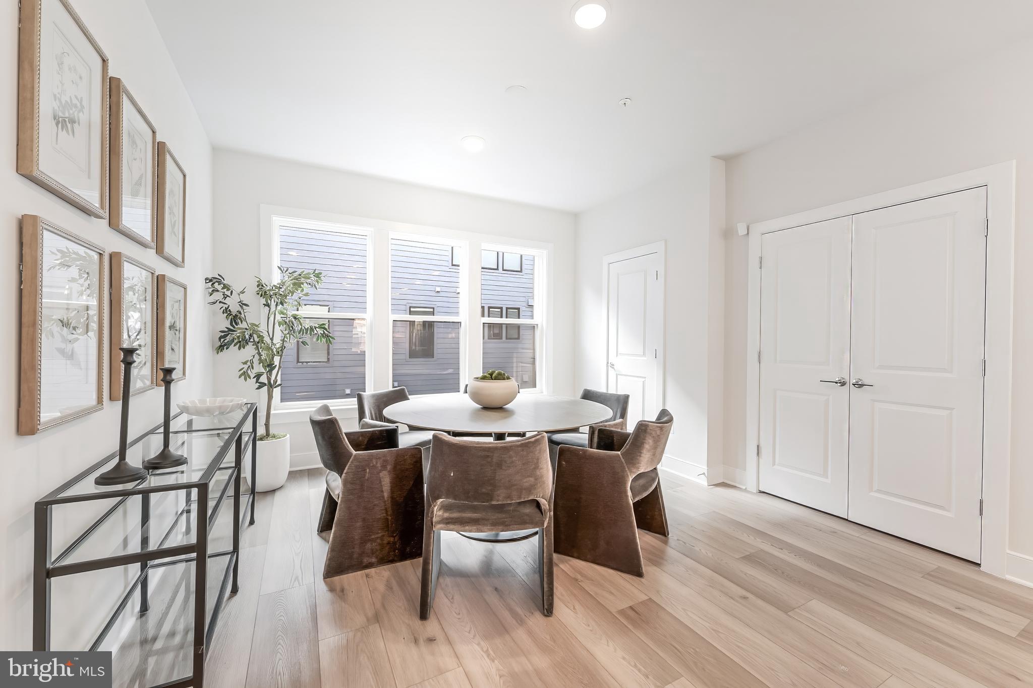 12742 Verdant Way Reston, VA 20191 - Photo 11 of 51 a view of a dining room with furniture window and wooden floor
