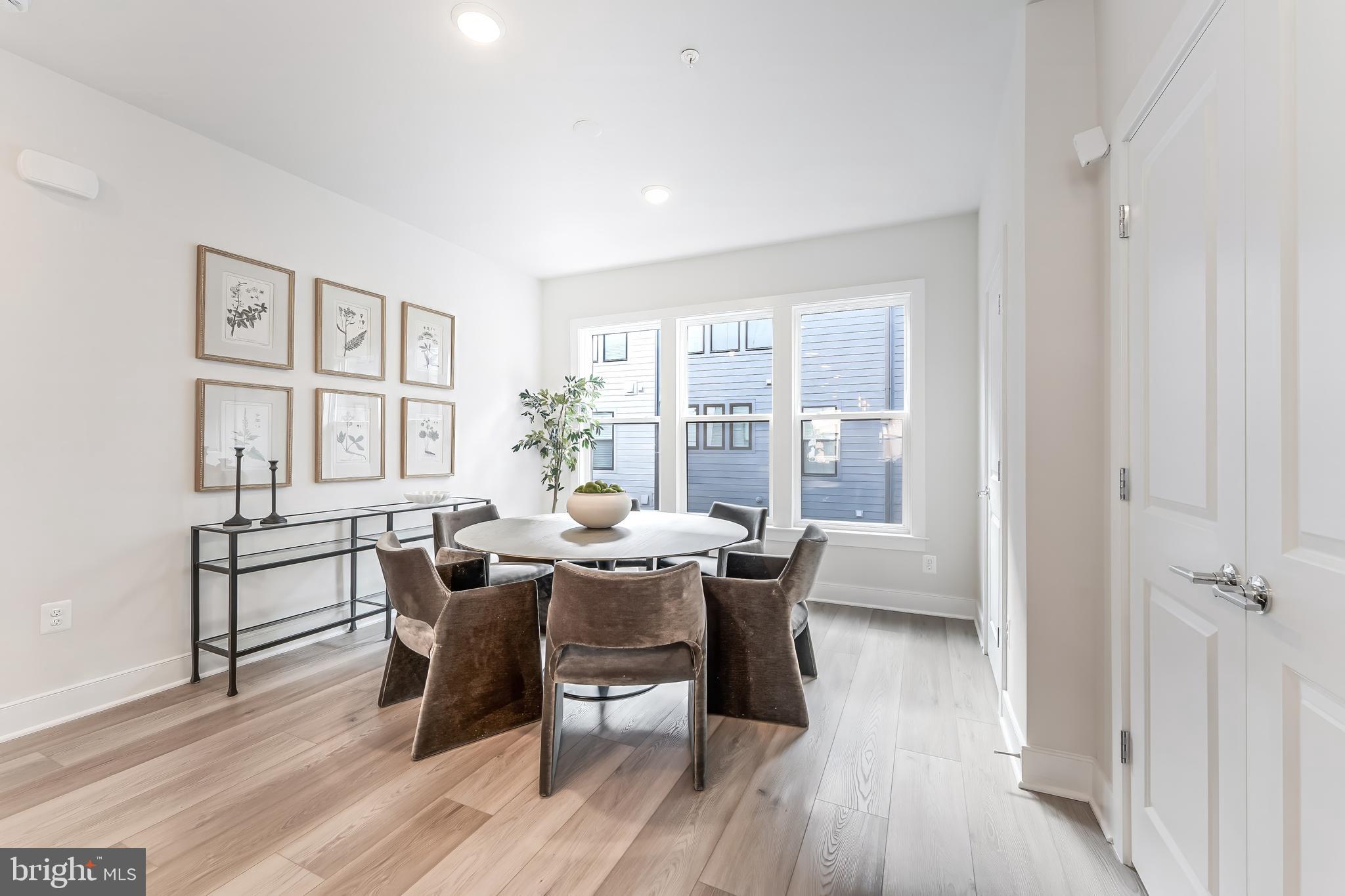 12742 Verdant Way Reston, VA 20191 - Photo 12 of 51 a view of a dining room with furniture and wooden floor