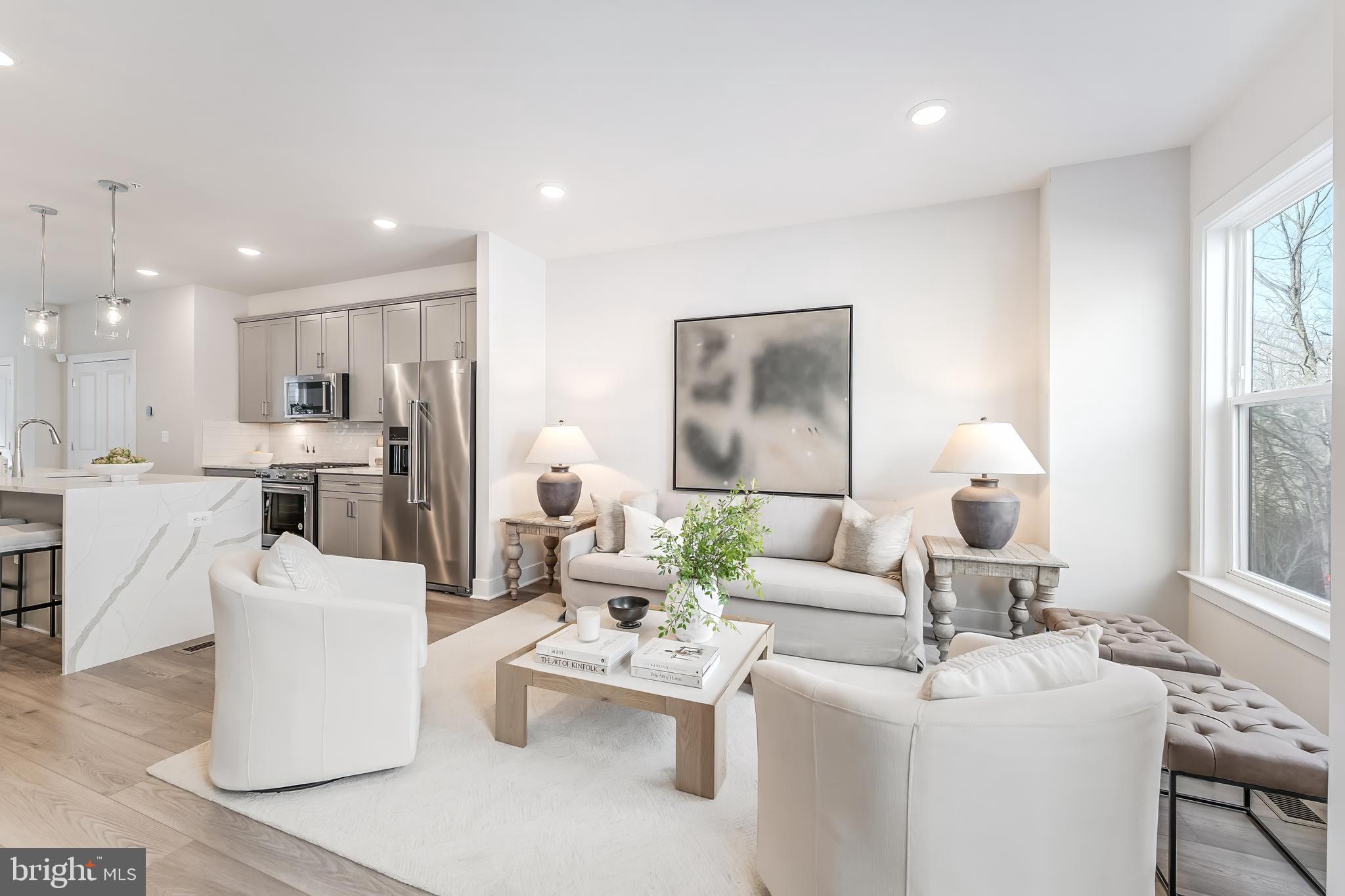 12742 Verdant Way Reston, VA 20191 - Photo 17 of 51 a living room with furniture and a large window