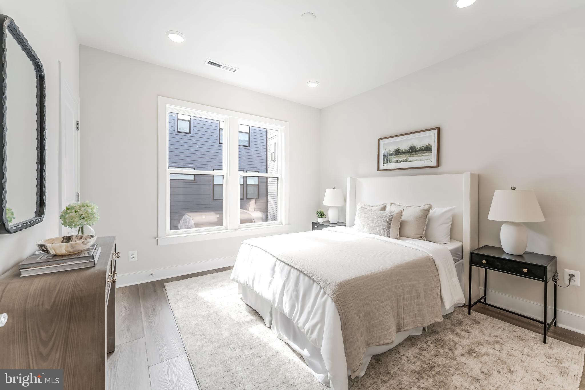 12742 Verdant Way Reston, VA 20191 - Photo 22 of 51 a bedroom with a bed and wooden floor