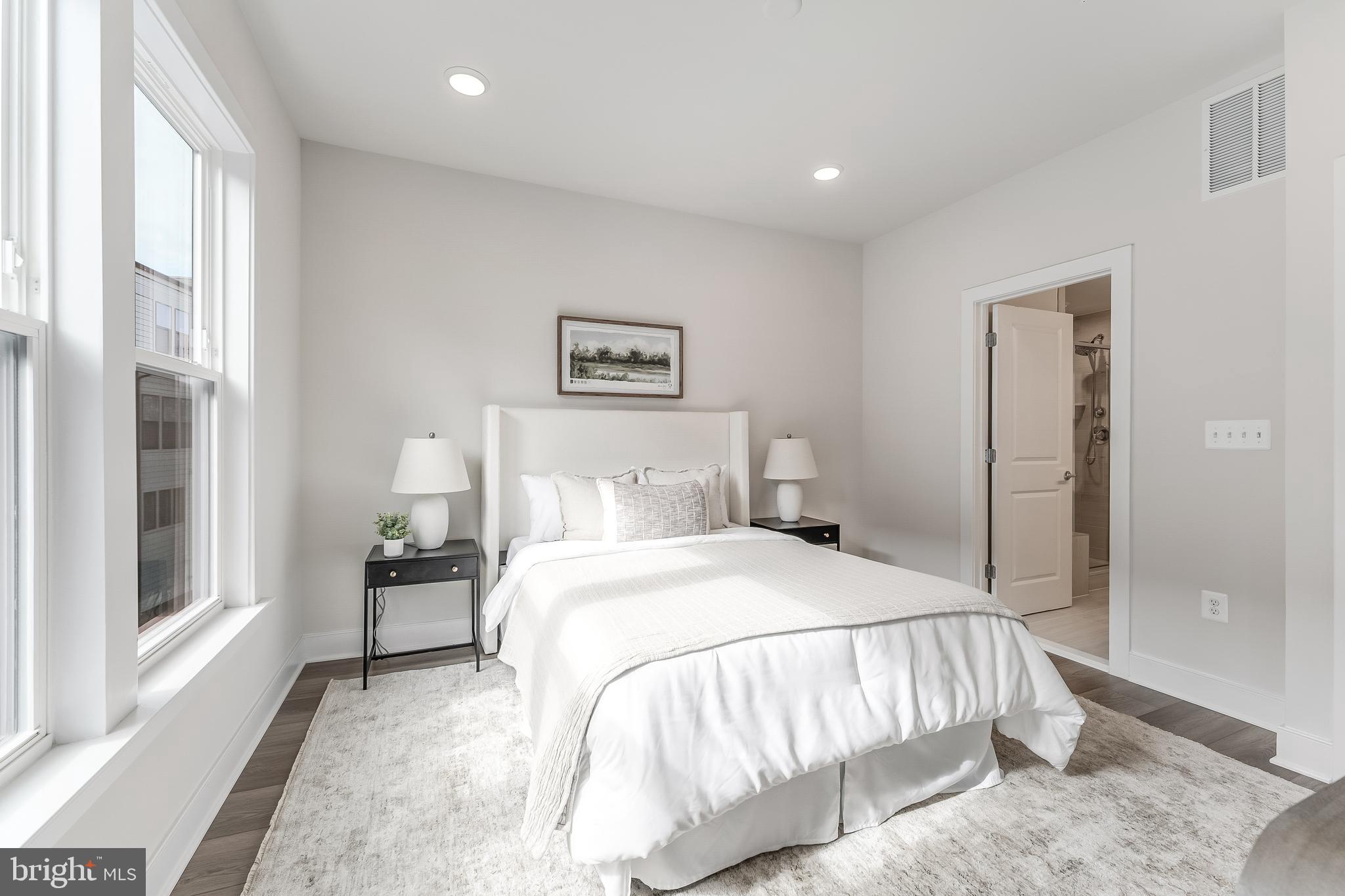 12742 Verdant Way Reston, VA 20191 - Photo 23 of 51 a bedroom with a bed and a painting on the wall