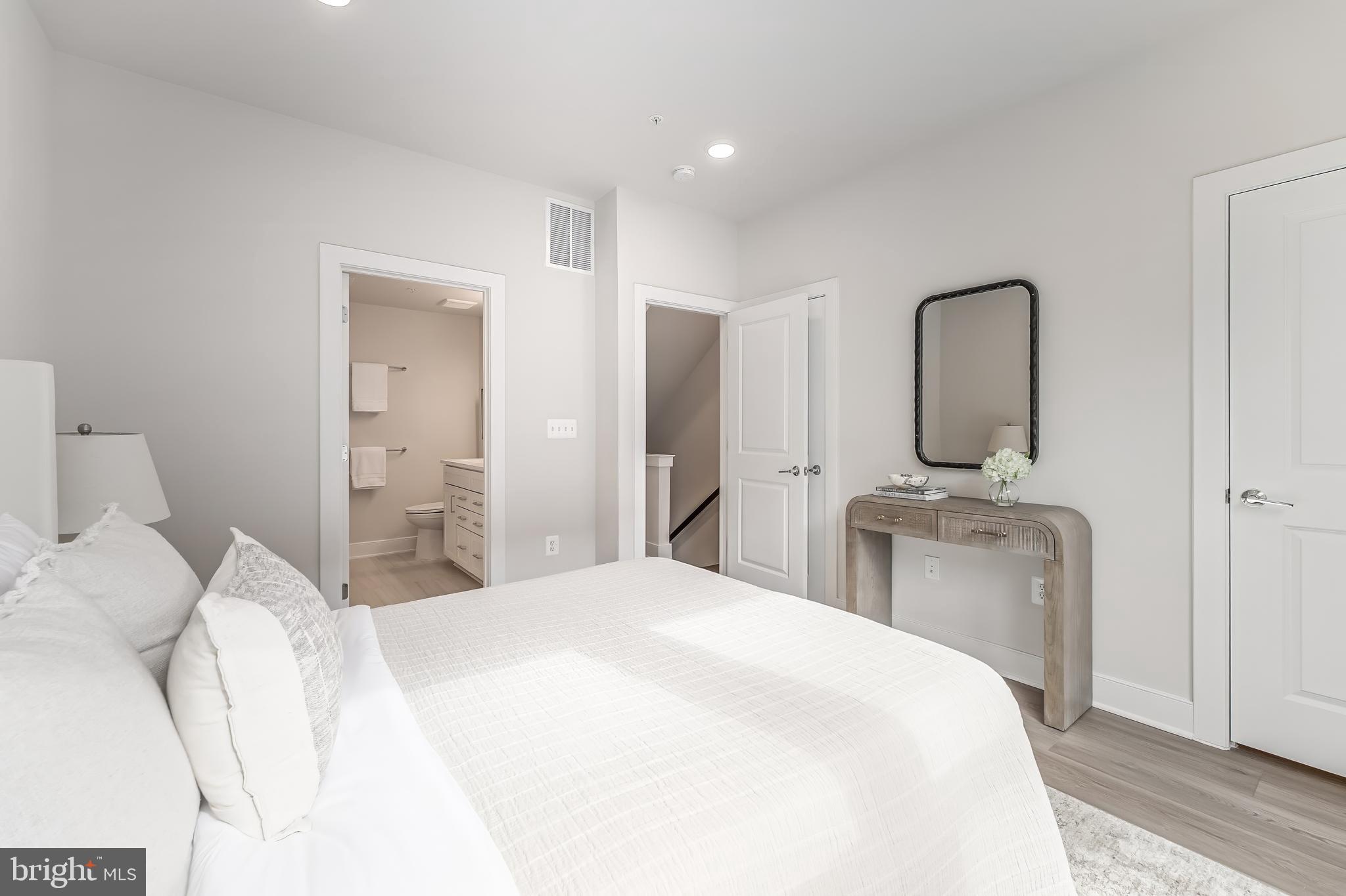 12742 Verdant Way Reston, VA 20191 - Photo 25 of 51 a bedroom with a bed and a mirror