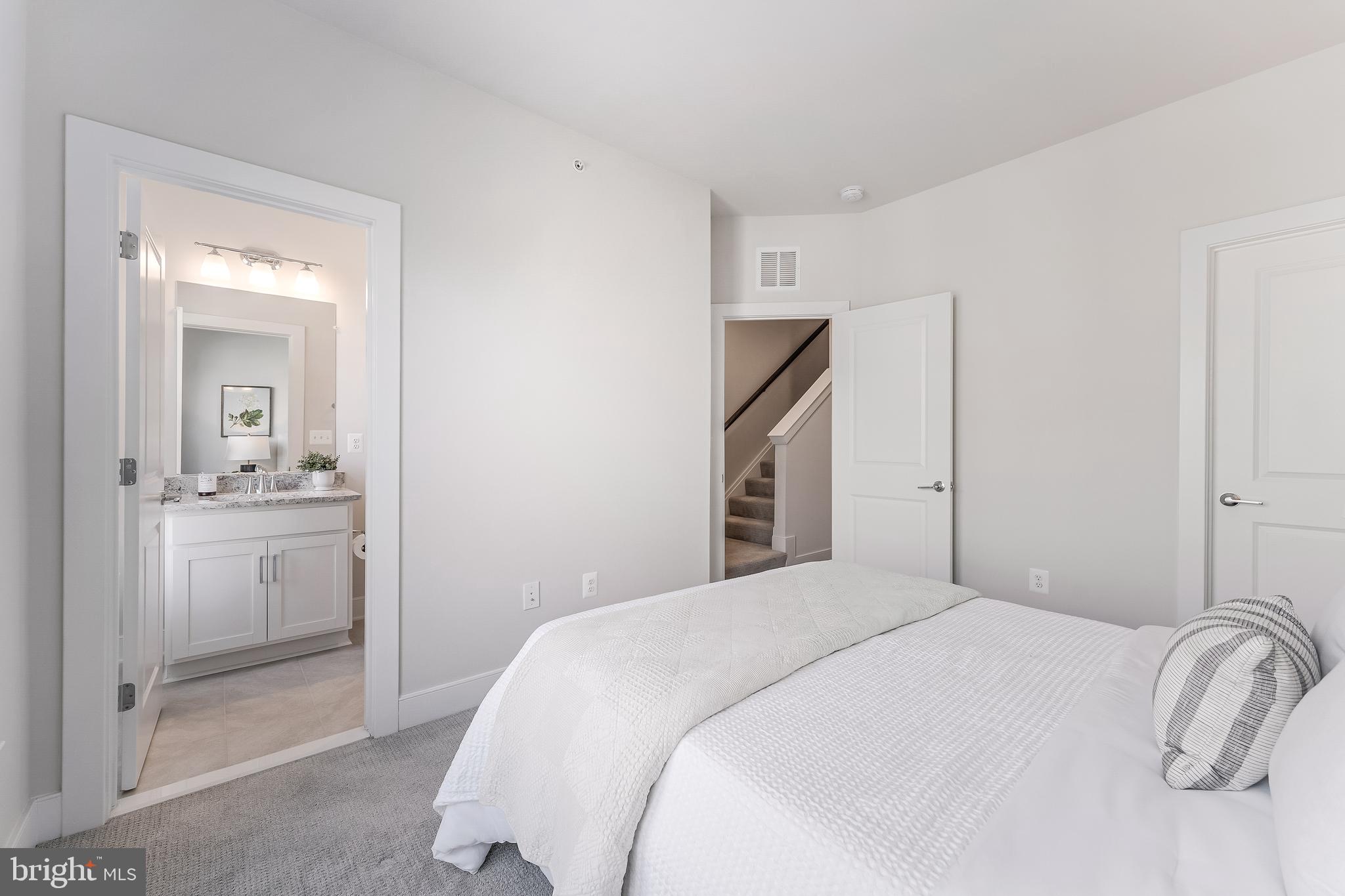 12742 Verdant Way Reston, VA 20191 - Photo 32 of 51 a bedroom with a bed and a dresser