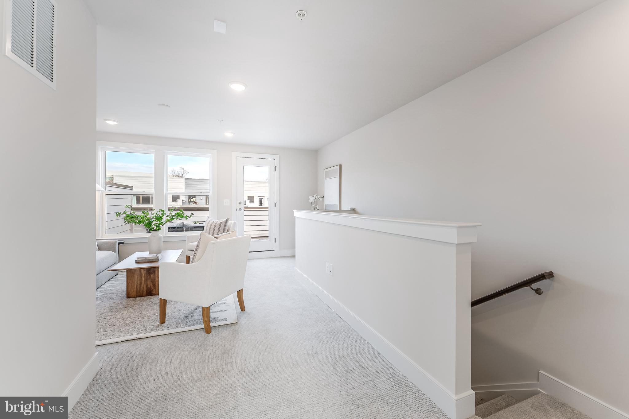 12742 Verdant Way Reston, VA 20191 - Photo 36 of 51 a room with kitchen island a sink and a refrigerator