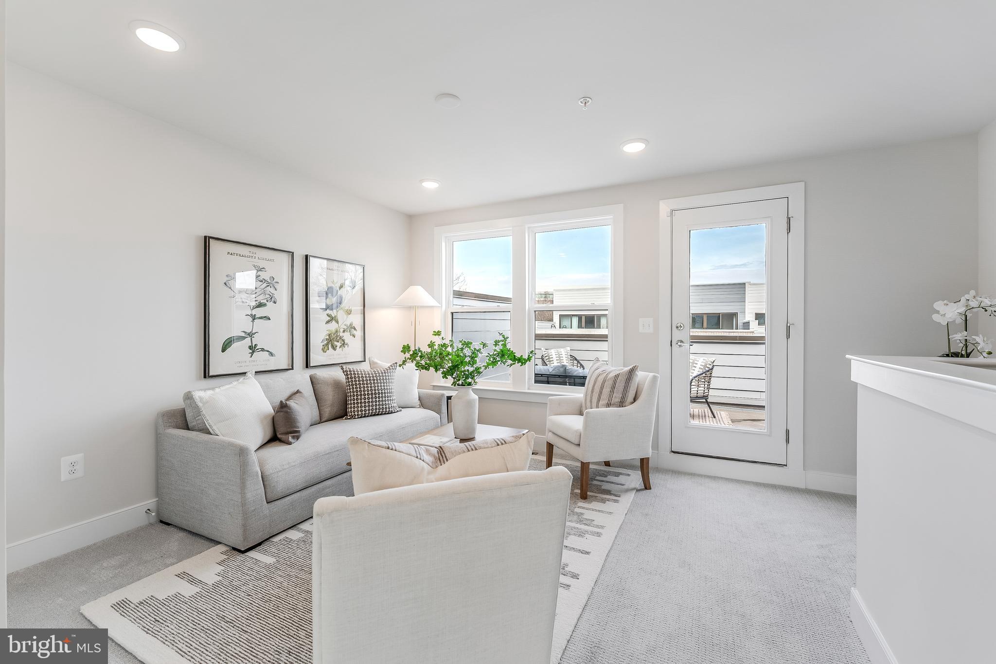 12742 Verdant Way Reston, VA 20191 - Photo 37 of 51 a living room with furniture and a large window