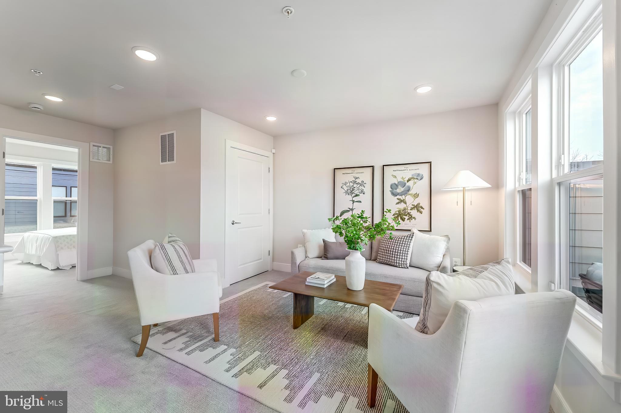 12742 Verdant Way Reston, VA 20191 - Photo 38 of 51 a living room with furniture and a large window
