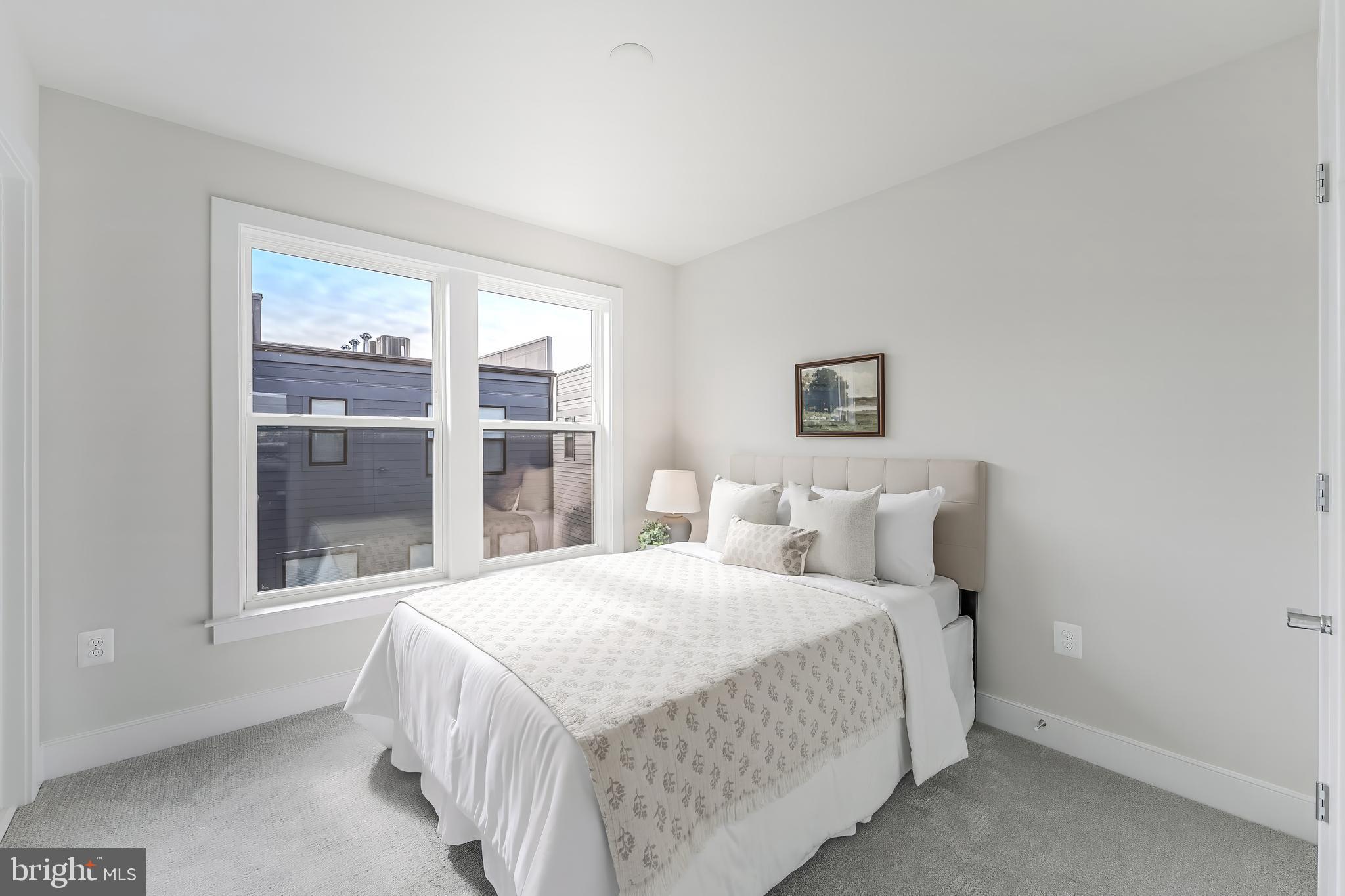 12742 Verdant Way Reston, VA 20191 - Photo 39 of 51 a bedroom with a bed and a large window