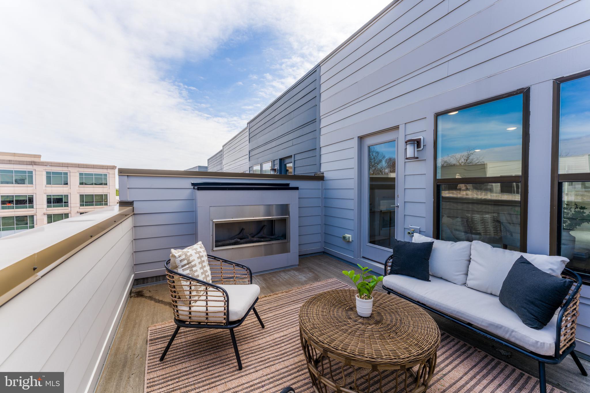12742 Verdant Way Reston, VA 20191 - Photo 44 of 51 a balcony with furniture and a fireplace