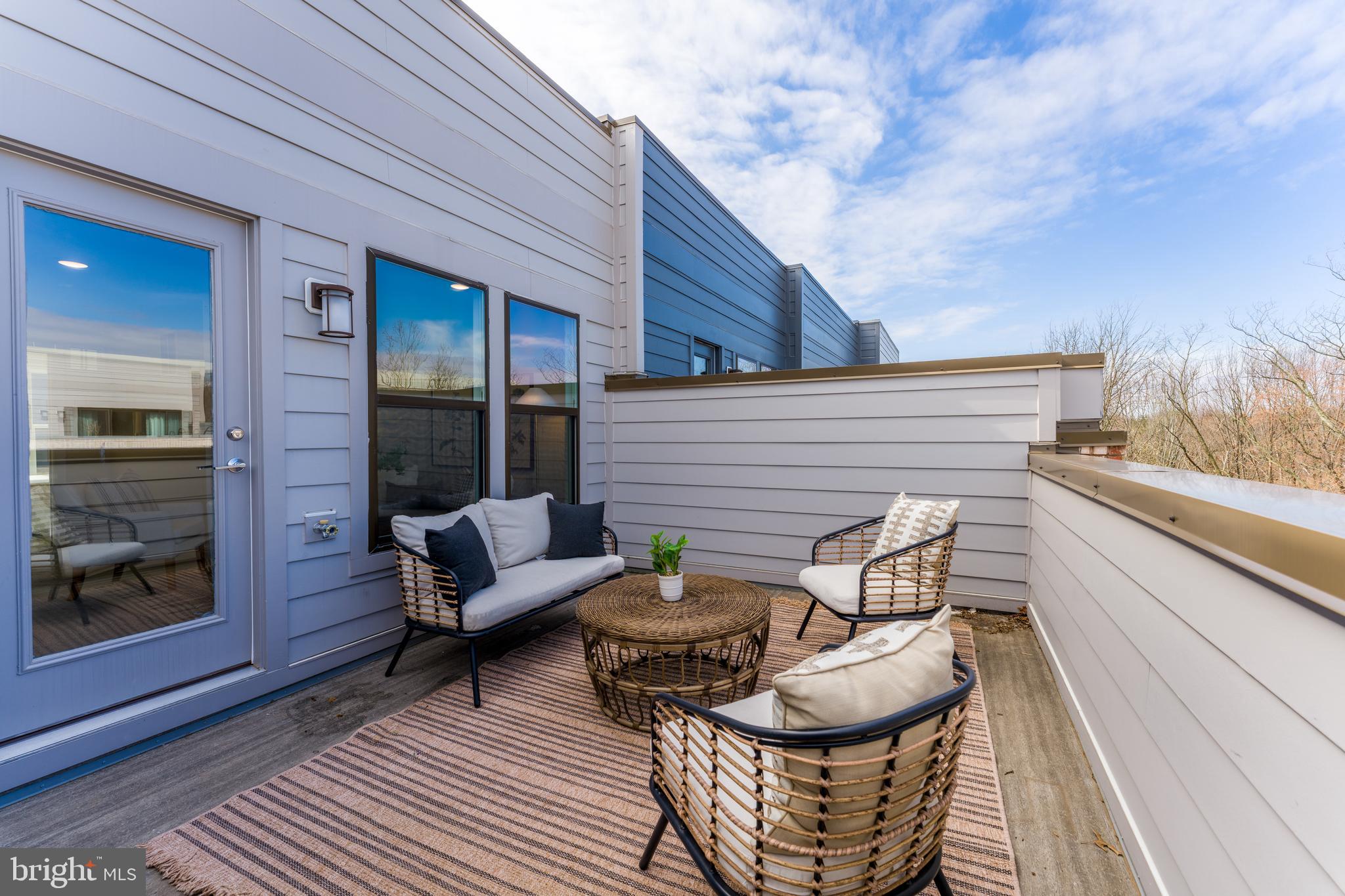 12742 Verdant Way Reston, VA 20191 - Photo 45 of 51 a balcony with furniture and wooden floor