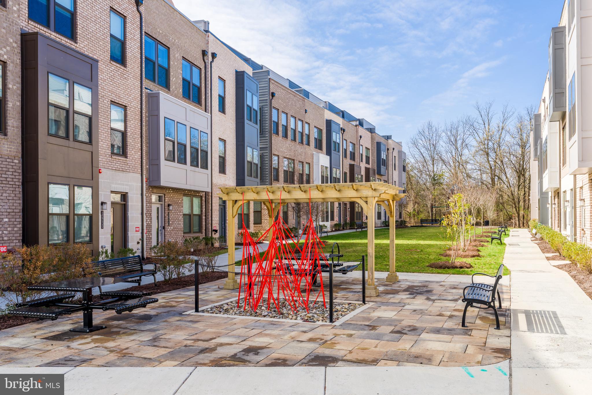 12742 Verdant Way Reston, VA 20191 - Photo 48 of 51 a view of a building with a yard