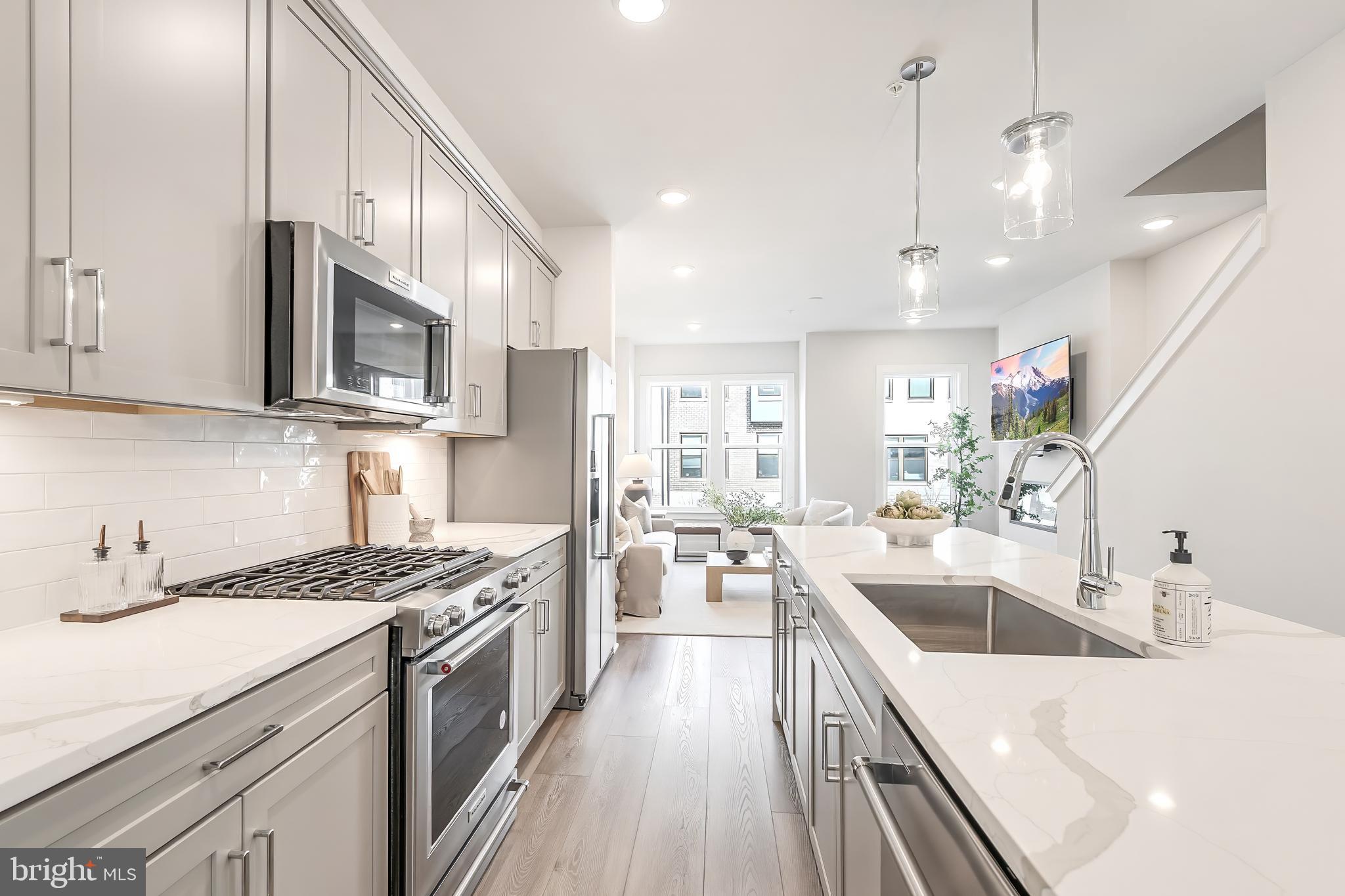 12742 Verdant Way Reston, VA 20191 - Photo 9 of 51 a kitchen with a sink stove top oven and refrigerator