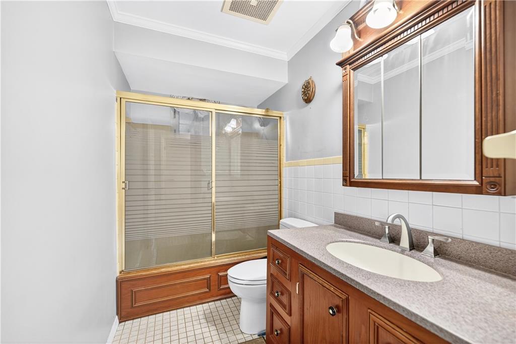 910 Burchfield Road Allison Park, PA 15101 - Photo 13 of 21 a bathroom with a granite countertop sink toilet mirror and shower