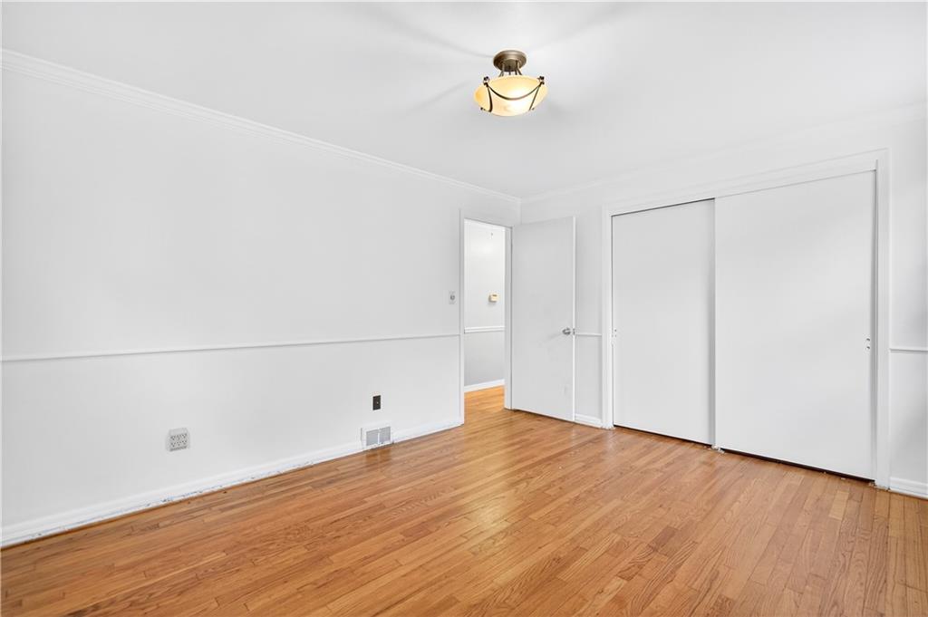 910 Burchfield Road Allison Park, PA 15101 - Photo 16 of 21 a view of a room with wooden floor and window