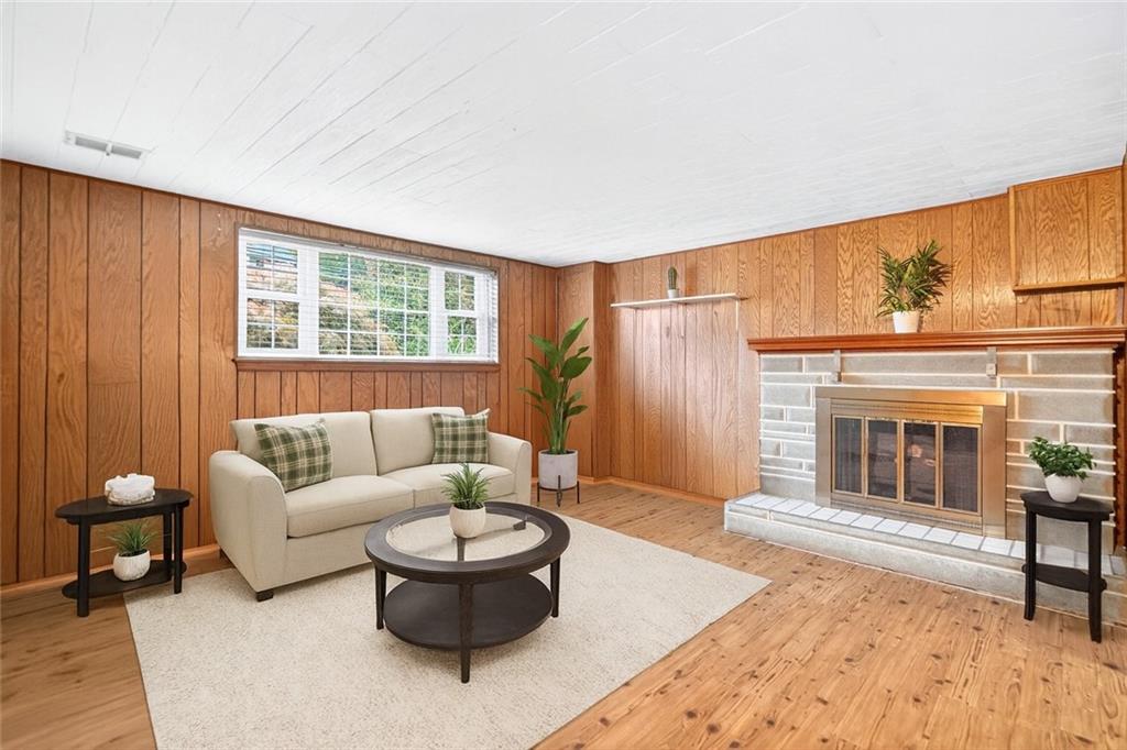910 Burchfield Road Allison Park, PA 15101 - Photo 17 of 21 a living room with furniture and a fireplace