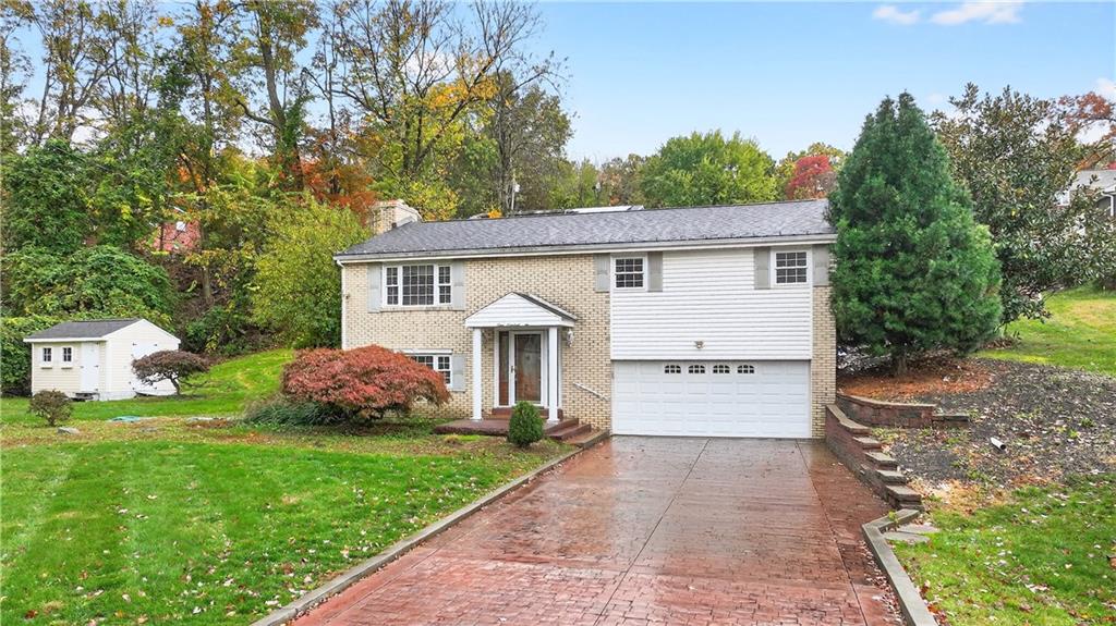 910 Burchfield Road Allison Park, PA 15101 - Photo 2 of 21 a view of an house with backyard space and garden