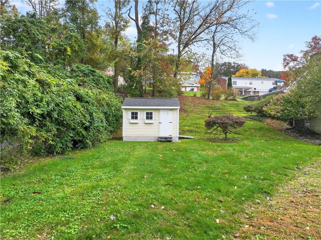 910 Burchfield Road Allison Park, PA 15101 - Photo 6 of 21 a backyard of a house with table and chairs
