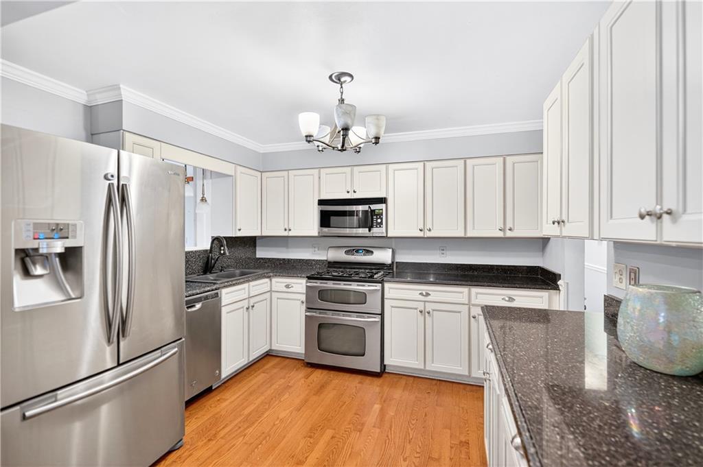 910 Burchfield Road Allison Park, PA 15101 - Photo 10 of 21 a kitchen with stainless steel appliances granite countertop a refrigerator a stove top oven a sink and dishwasher