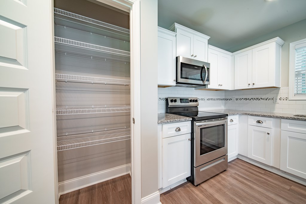 16 Maxwell Drive Fort Mitchell, AL 36856 - Photo 25 of 25 a kitchen with stainless steel appliances granite countertop white cabinets and a stove