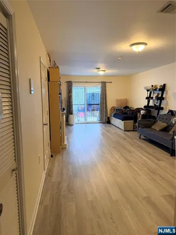 a view of a livingroom with furniture and a window