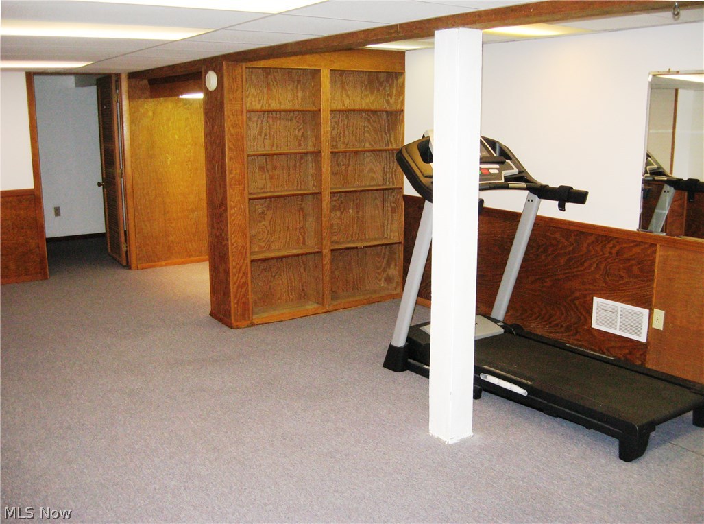 228 South Hametown Road Akron, OH 44321 - Photo 15 of 18 Finished basement with built in shelves and fresh paint.