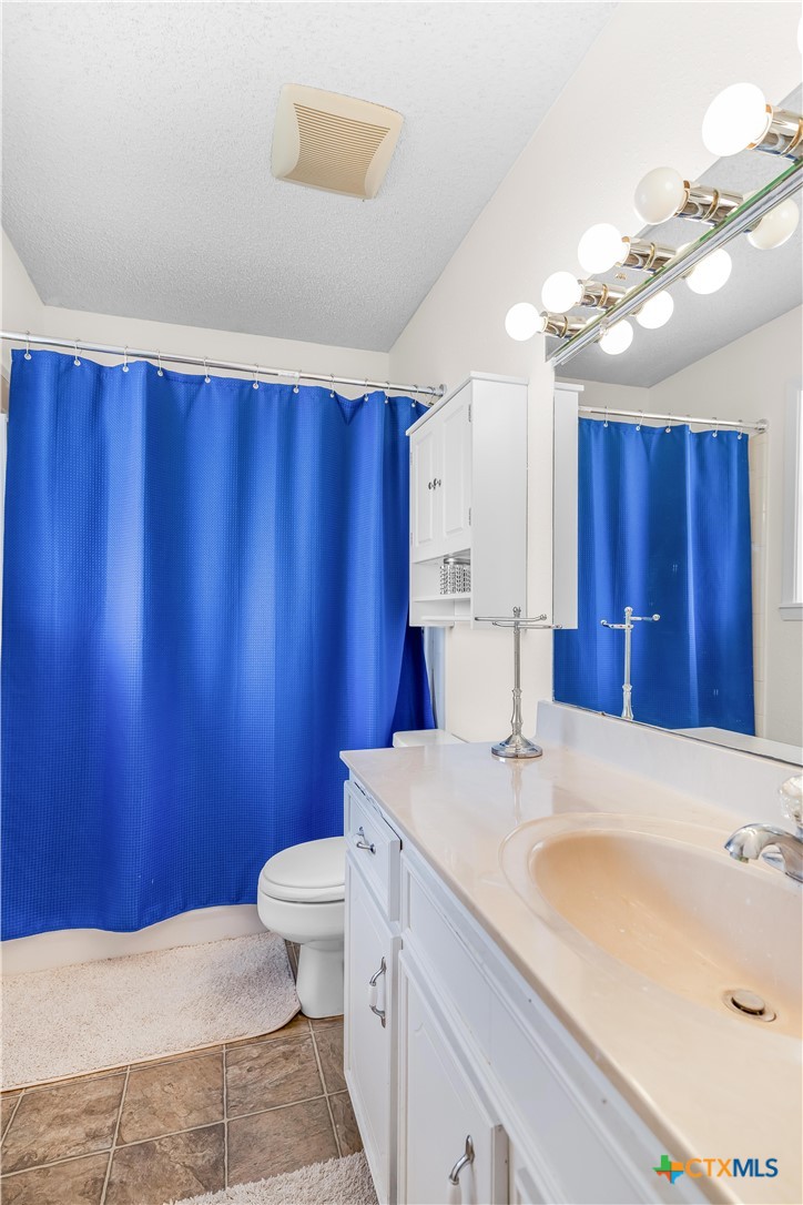 307 Pheasant Drive Victoria, TX 77905 - Photo 15 of 33 a bathroom with a sink a toilet and mirror
