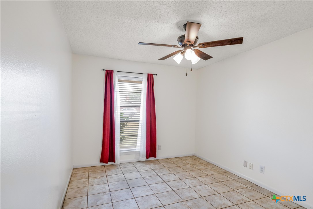 307 Pheasant Drive Victoria, TX 77905 - Photo 18 of 33 a view of a room with a fan and a window