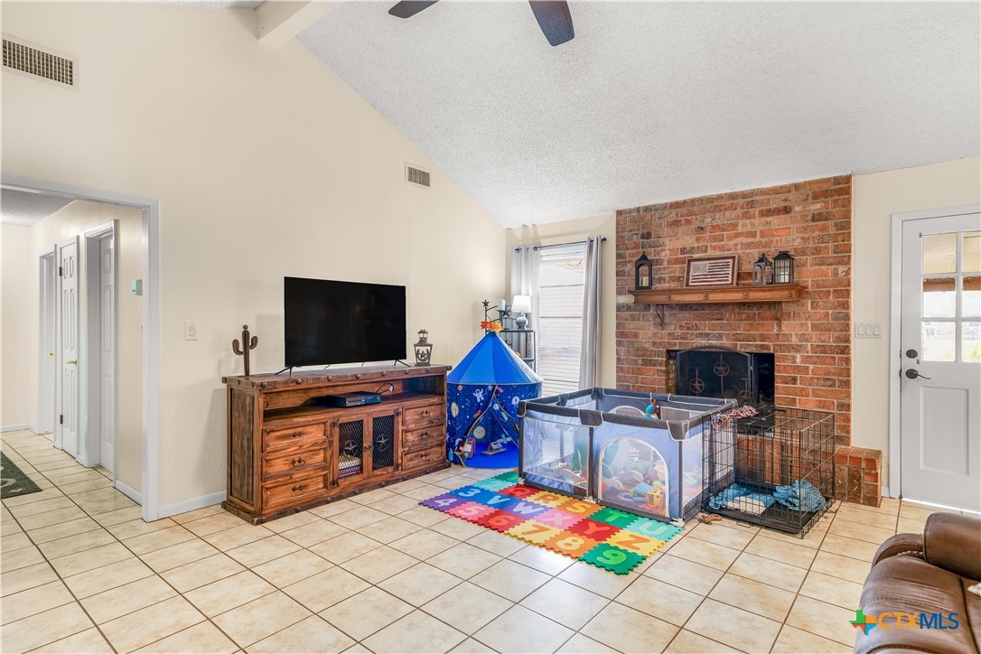 307 Pheasant Drive Victoria, TX 77905 - Photo 2 of 33 a living room with furniture and a flat screen tv