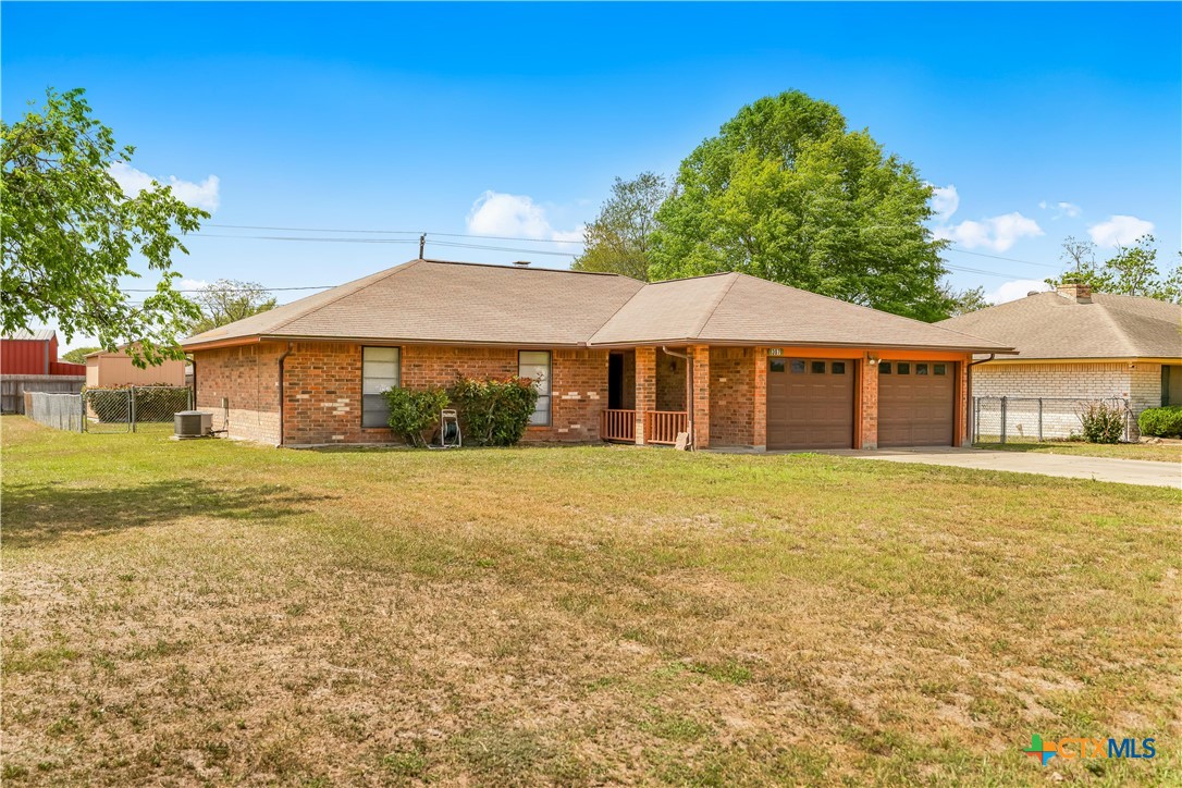 307 Pheasant Drive Victoria, TX 77905 - Photo 30 of 33 a front view of a house with a yard