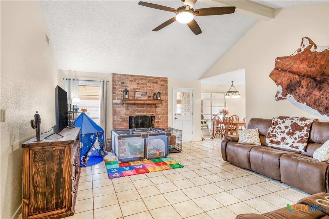307 Pheasant Drive Victoria, TX 77905 - Photo 4 of 33 a living room with furniture and a flat screen tv