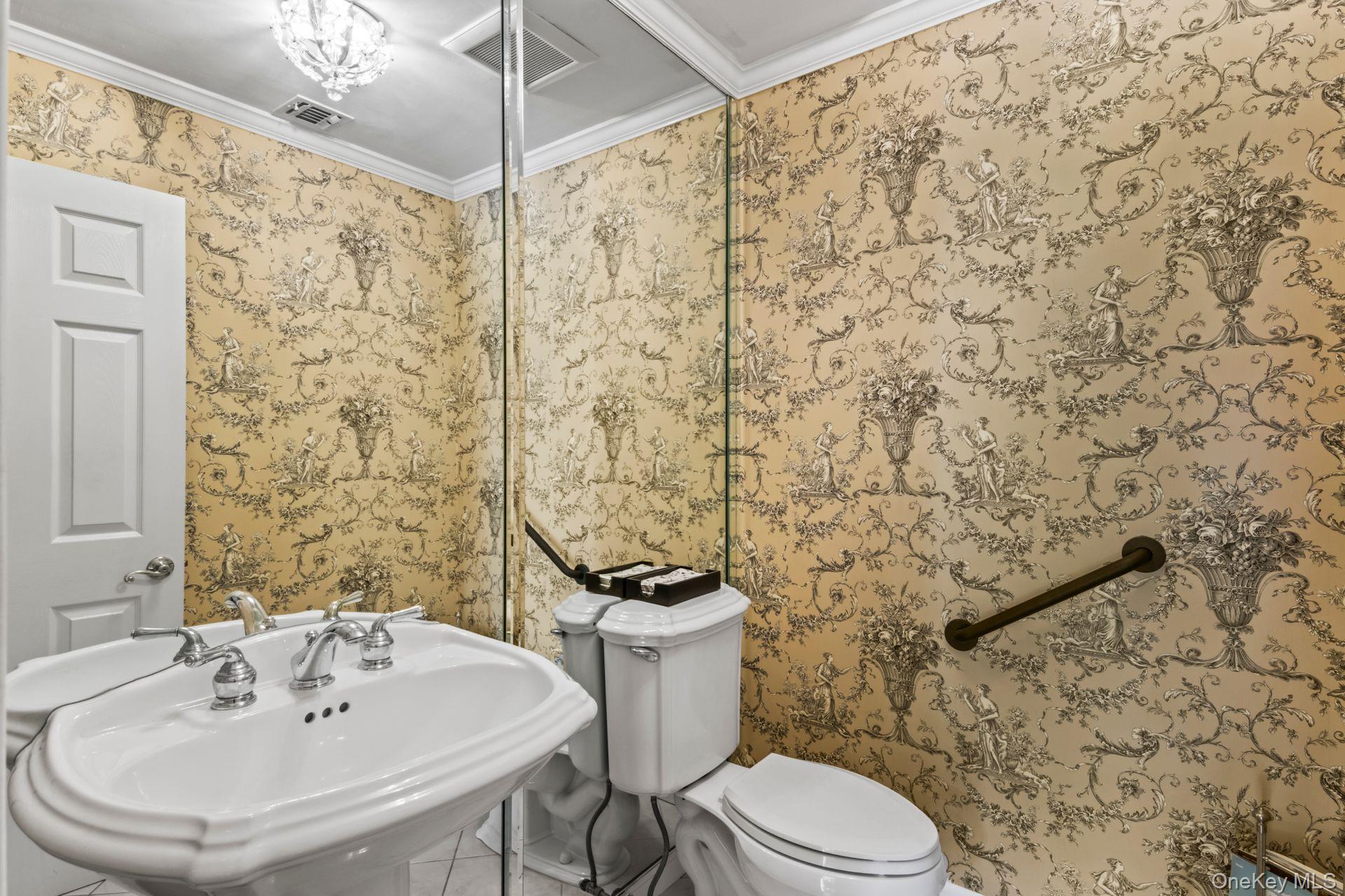 77 The Woods Commack, NY 11725 - Photo 16 of 31 Half bathroom with wallpapered walls and crown molding